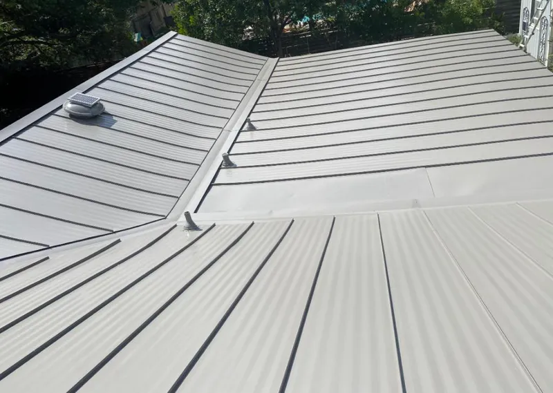 Solar attic fan installed on a metal roof for Roof Ventilation in Hoschton